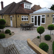A brick house with a tiled patio