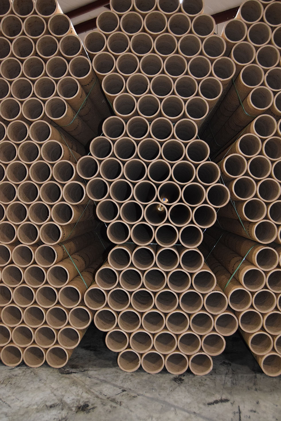 View of large stack of bundled cardboard tubes
