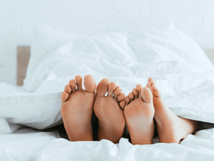 A couple cosy under the covers