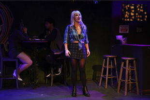 Kylie singing on stage