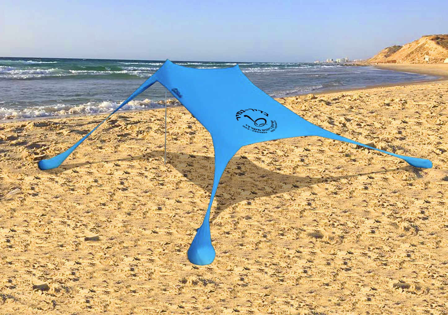 אוהל לים עם שקי חול