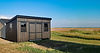 Brown-Black-Trim-Modern-Studio-Shed-in-Field-2-scaled.jpg