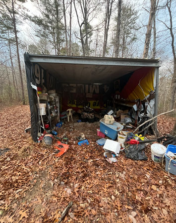 Cluttered shed before junk removal cleanout in Dahlonega GA