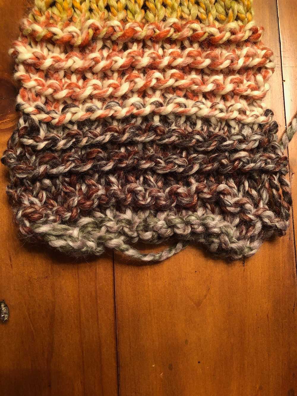 Learning to knit with size 15 wooden needles