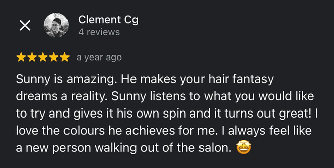 Client showing off a new personalised haircut in a Melbourne CBD salon, with a glowing 5-star Google review praising Sunny’s thoughtful and confident styling.