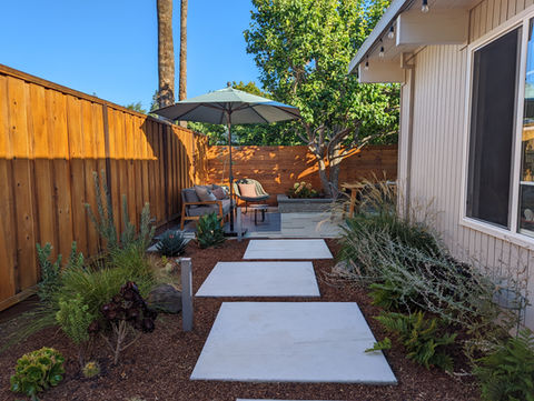 A 360 degree landscape project for this Mountain View California home. This project transformed a modest residential backyard into a serene retreat with true West Coast style. The design featured native drought-resistant plants, showcasing a palette of muted colors and textures that reflect the region's natural beauty. A simple stone pathway guides visitors through the space, leading to a cozy seating area surrounded by low-maintenance grasses and succulents. The project enhances the home's aesthetic while promoting sustainability, aligning perfectly with the area's commitment to environmental stewardship.