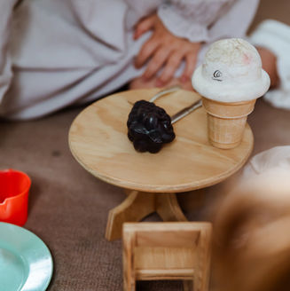 Wooden tray with toy ice cream and fruit, used for feeding and language exercises in therapy