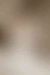 mother of the bride zipping daughters wedding gown