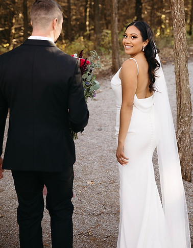 bride in groom walking on a gravel road fall vineyard wedding