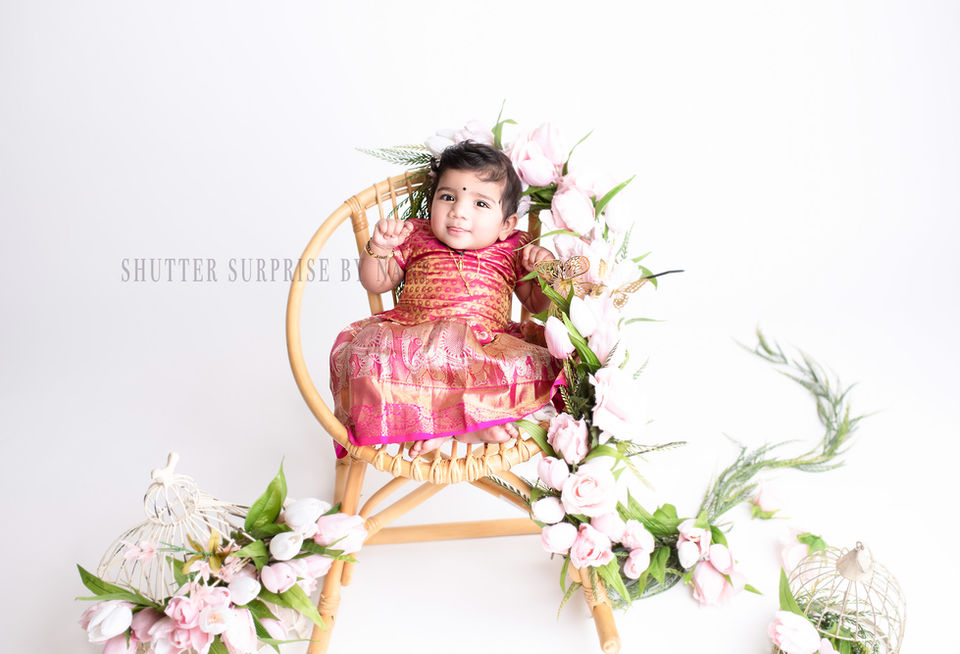 2. Smiling baby in traditional Indian milestone outfit photographed in Plano studio. Frisco, Texas Baby Photography. Milestone photography in Frisco, Texas.