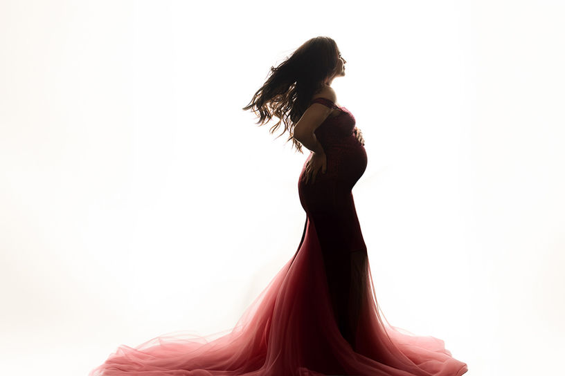 Fine art maternity session photographed in Plano, TX — featuring professional posing, soft lighting, and curated styling