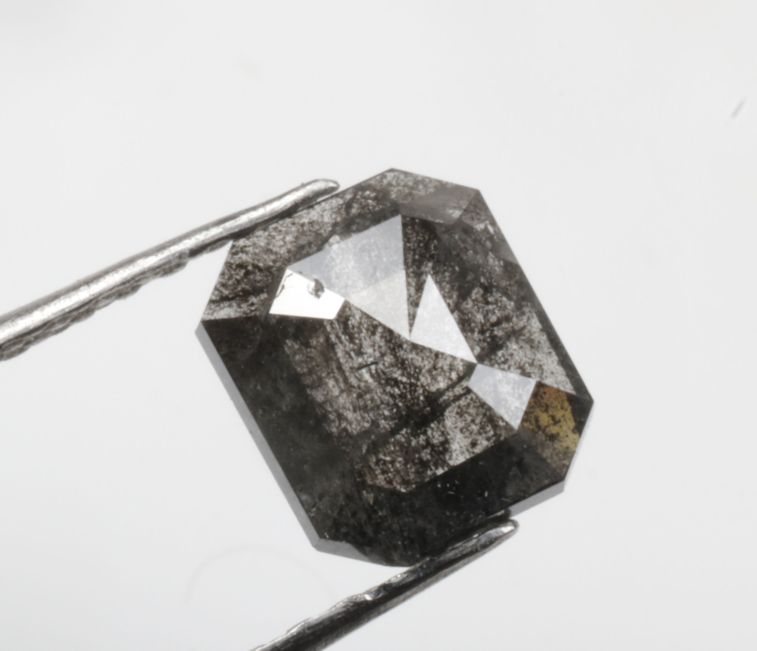 0.56 CT 5.9 X 5.1 MM Natural Emerald Cut Slat and Pepper Diamond Black color