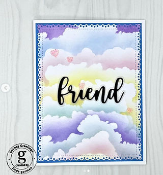 Greeting card featuring rainbow colored clouds on a lightly decorative border