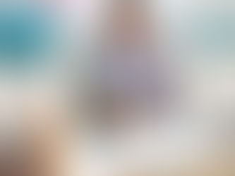 Memorial image of woman at the beach, holding a shell