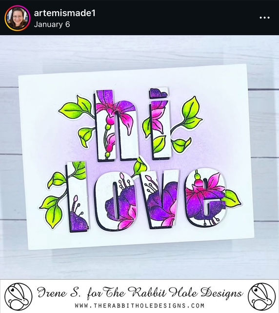Colorful card with "hi LOVE" in bold letters adorned with pink and purple fuchsias and green leaves on a light purple background. Logo and text below.