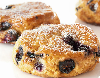 Blueberry scones dusted with powdered sugar