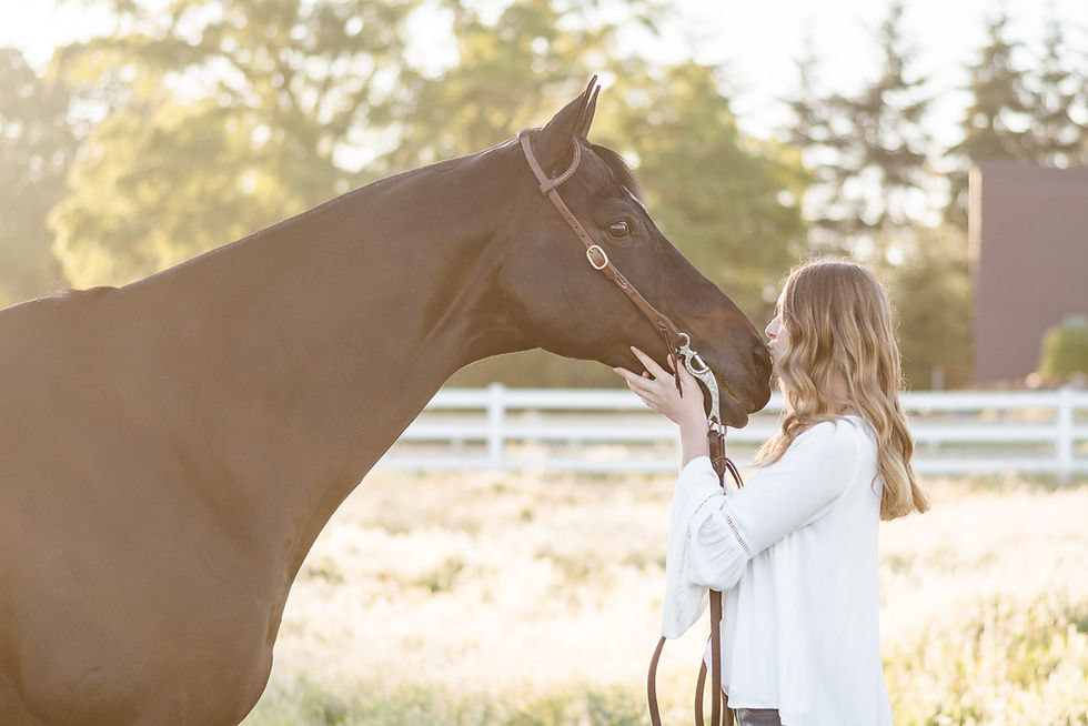 Lily Richardson kissing her horse, Riley on the nose