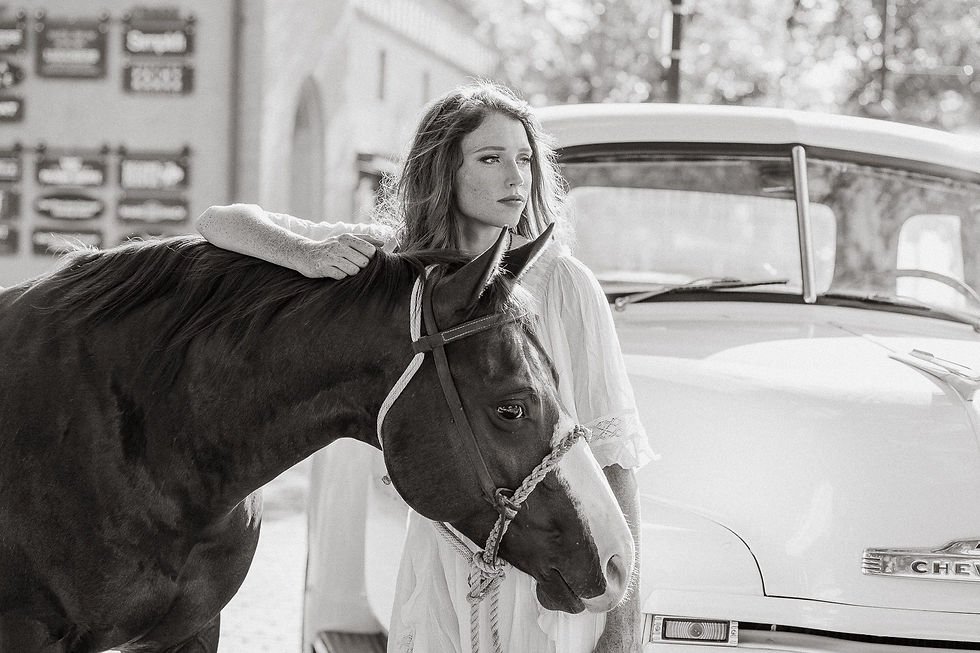 Casey in a Free People white maxi dress with her sorrel quarter horse, Turkey at the Fort Worth Stockyards