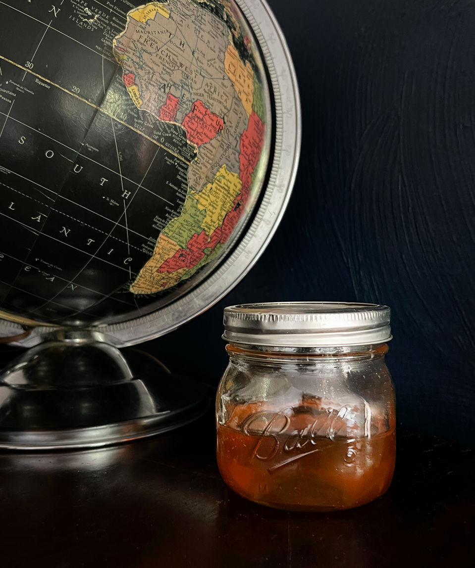 pot of honey with globe