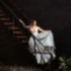 Woman Graduate Standing on Staircase in Grande Prairie Alberta