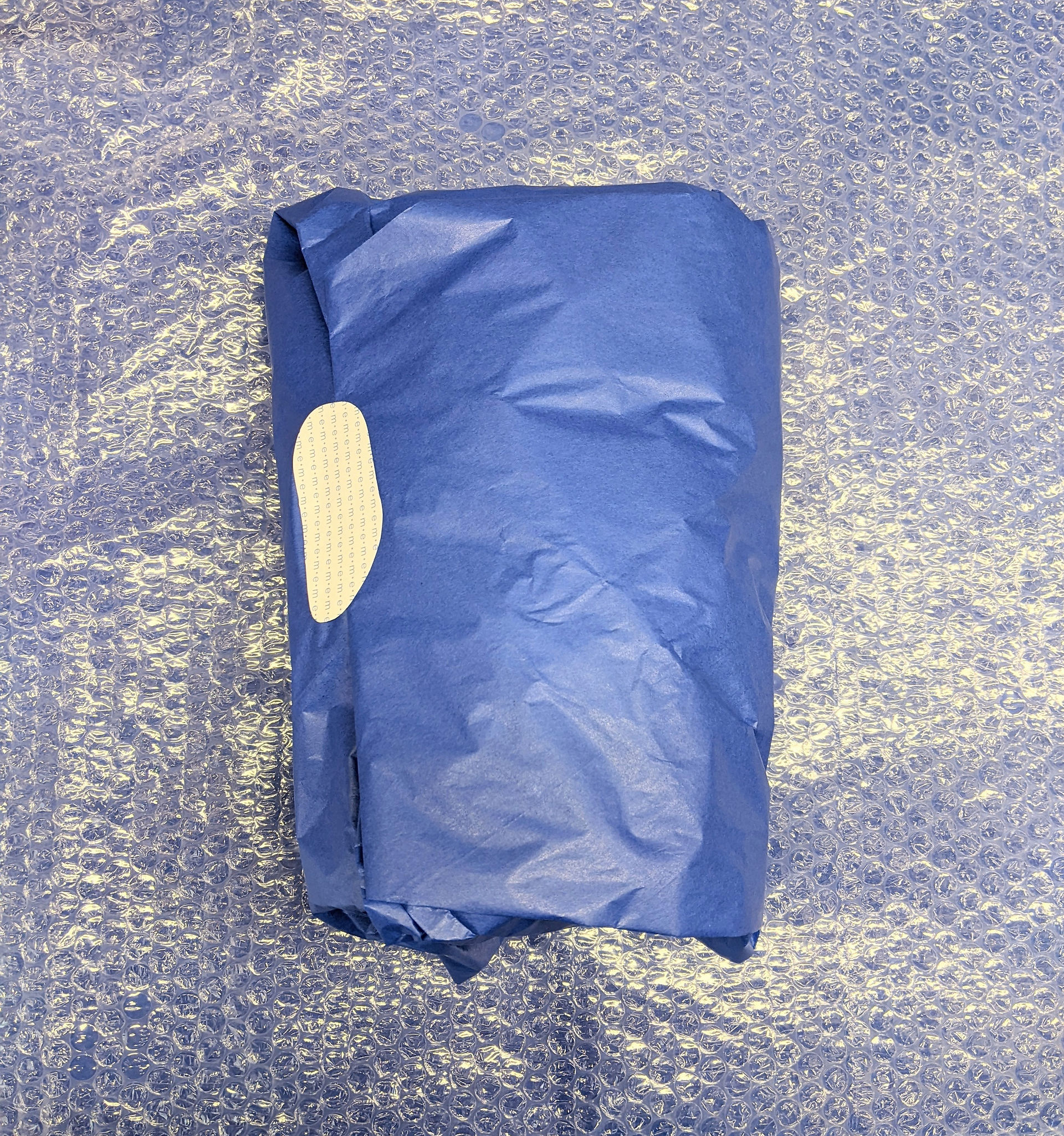 Neat wrapping in royal blue paper and hand cut stickers