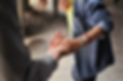 man and woman holding hands on street_ed