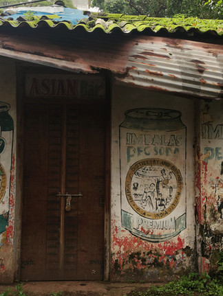 Colourful streets of Goa showcasing traditional Goan houses, pastel walls, and everyday street life