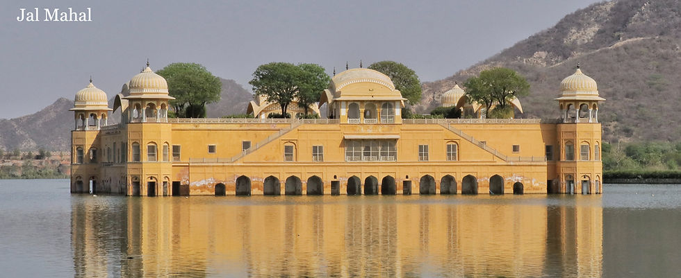 Jal Mahal floats on a calm lake, surrounded by arid hills. The yellow palace reflects in the water. Text reads "Jal Mahal" in white.