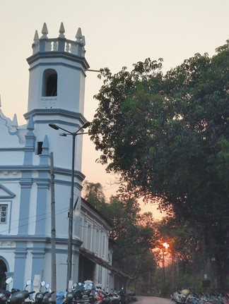 Colourful streets of Goa showcasing traditional Goan houses, pastel walls, and everyday street life