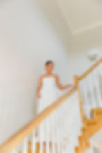bride down stairs first look