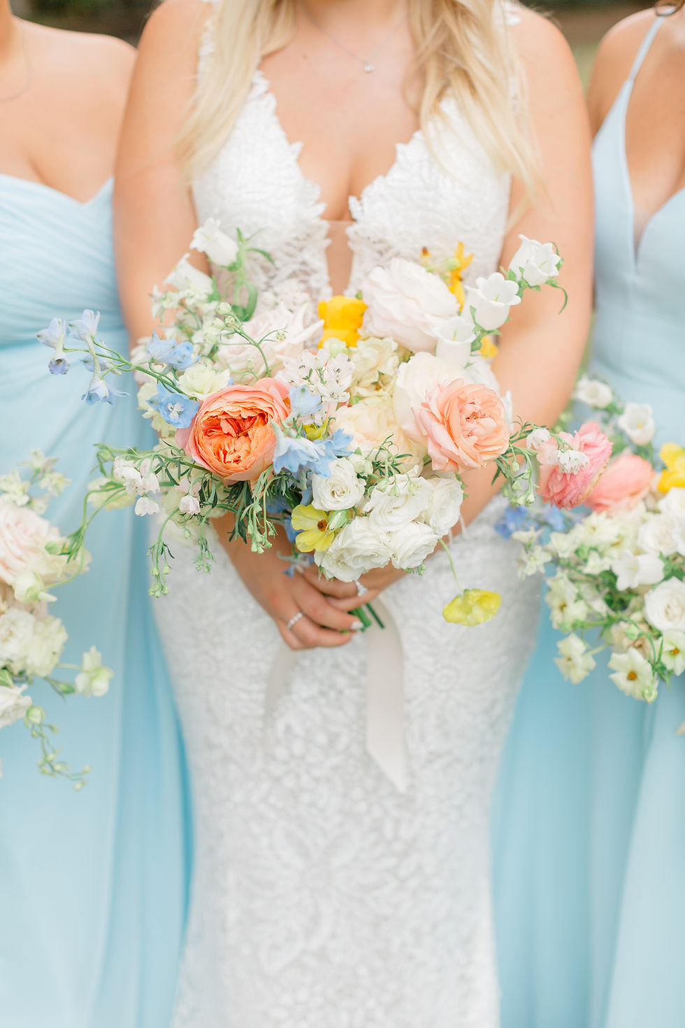 destination beach wedding isle of palms south carolina photographer and videographer blue bridesmaids pastel bouquet