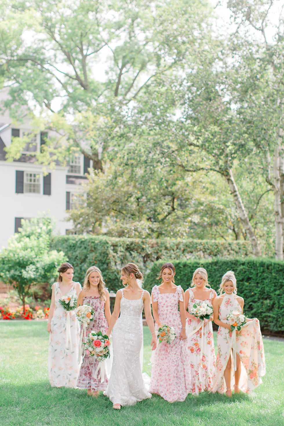 mismatched bridesmaids floral dresses woodstock vermont wedding - new england wedding photographer and videographer