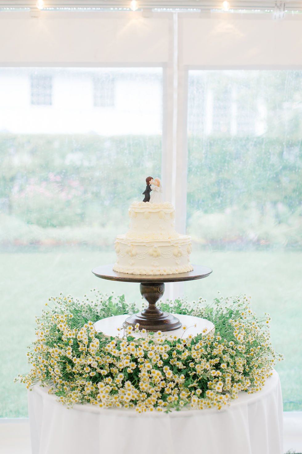 wedding cake with florals vermont wedding design by new england wedding photographer and videographer
