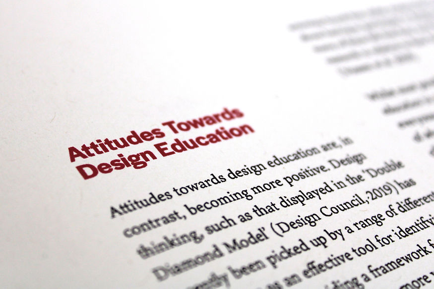 A close-up photo of a section of the book, titled 'Attitudes Towards Design Education'.