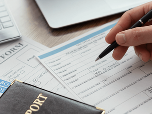 Foreign worker filling out work permit application form for NTS permit Singapore under Ministry of Manpower regulations