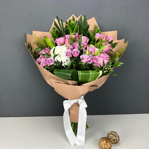 Soft lavender, pink, and white flowers, wrapped in a nude matte finish waterproof paper. No vase included.