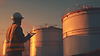 beneftee_Industrial_fuel_storage_tanks_at_sunrise_golden_raki_c3778698-0b50-4a26-8171-84e4