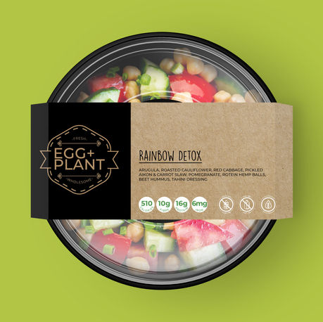 An Egg+Plant salad on a green background