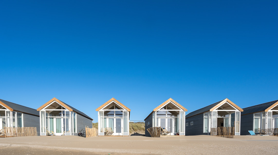 beautiful-shot-resting-cabins-sand-beach.jpg