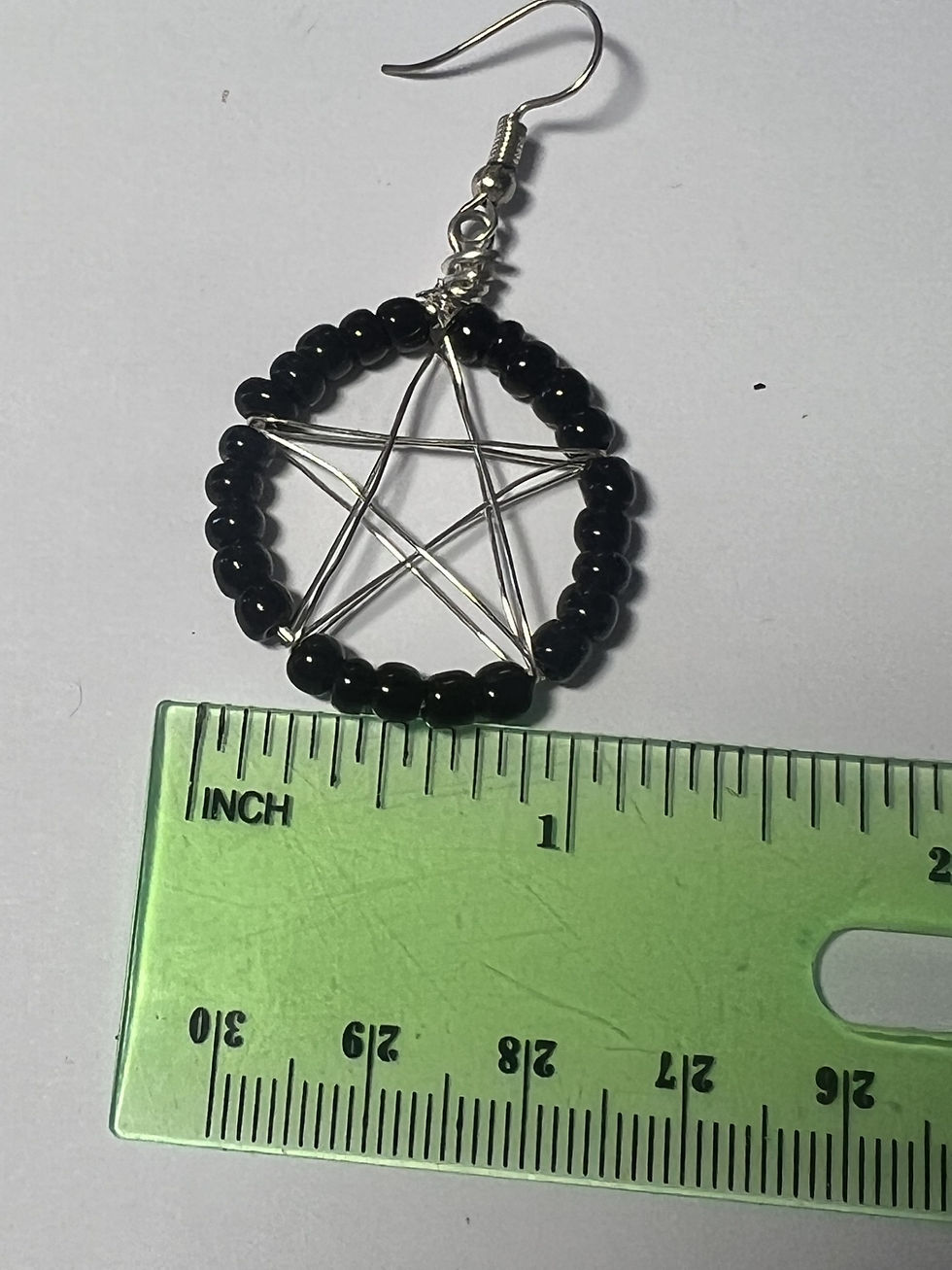Thumbnail: Handmade silver wire wrapped pentacle earrings with black bead in a mystical style measure