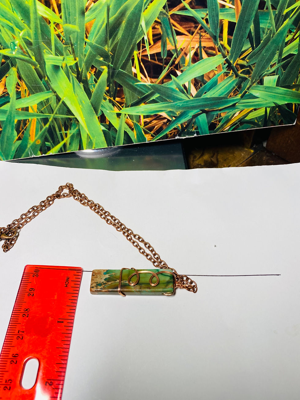 Thumbnail: Wire wrapped green jasper necklace with handcrafted copper wire surrounding a natural green gemstone width