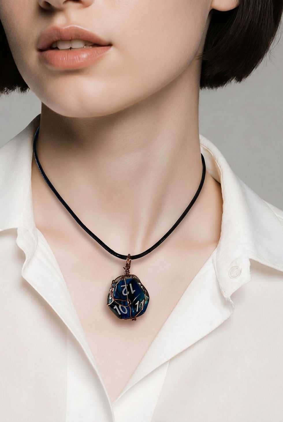Handmade wire wrapped D12 dodecahedron dice necklace featuring a suspended twelve-sided gaming die pendant on model