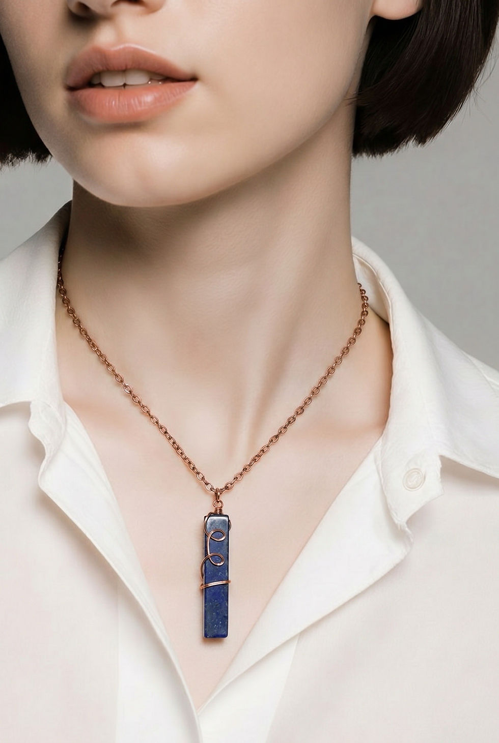 Wire wrapped lapis lazuli necklace available in silver copper or gold wire on model