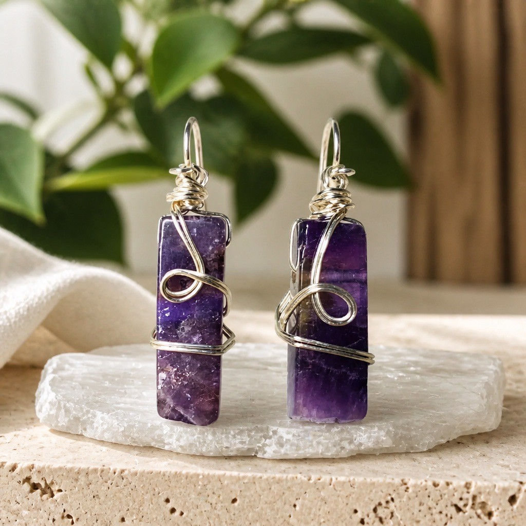 Handmade amethyst stick stone earrings wrapped in swirling silver wire