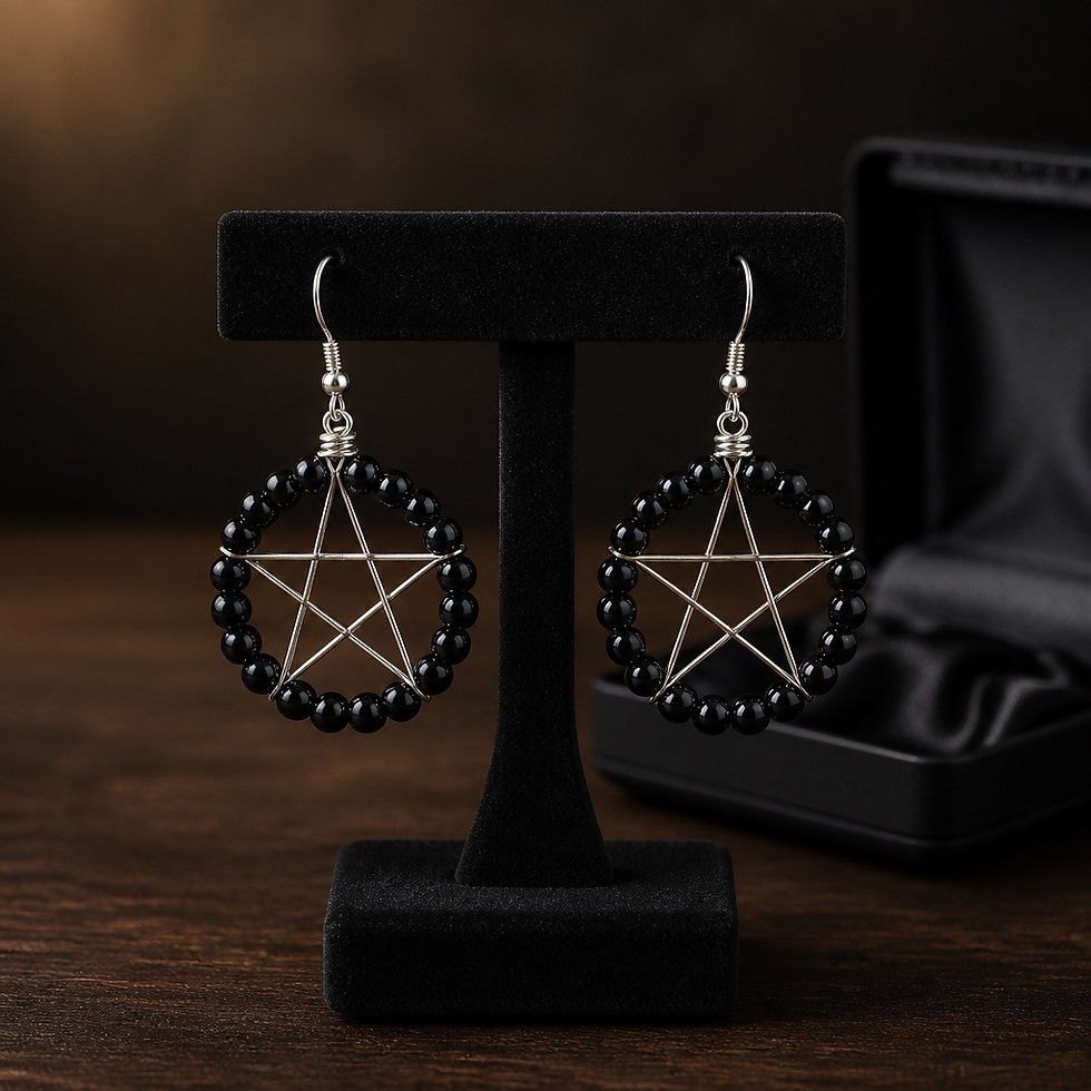 Handmade silver wire wrapped pentacle earrings with black bead in a mystical style