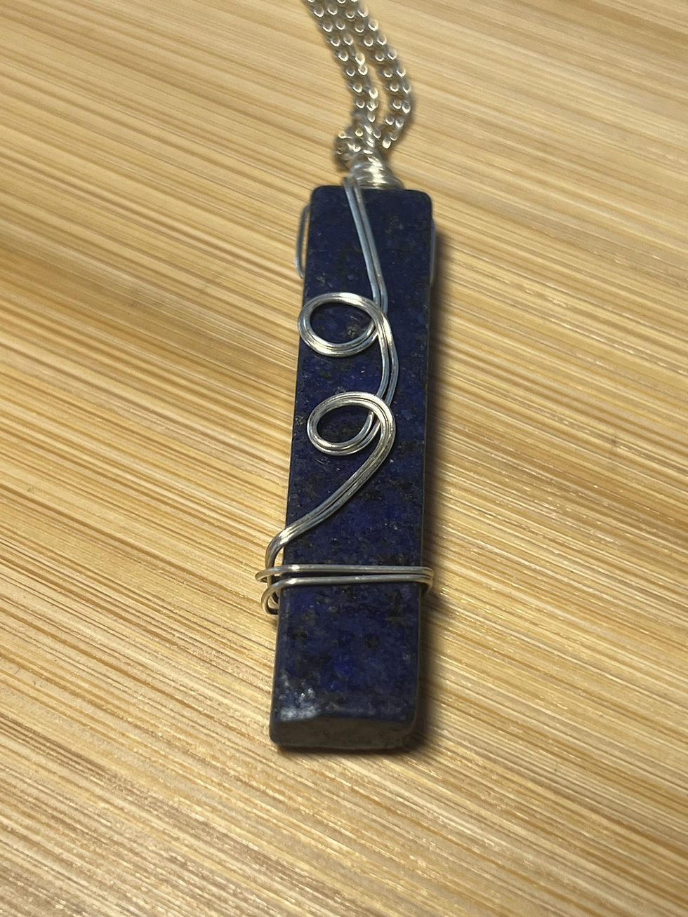 Thumbnail: Wire wrapped lapis lazuli necklace available in silver