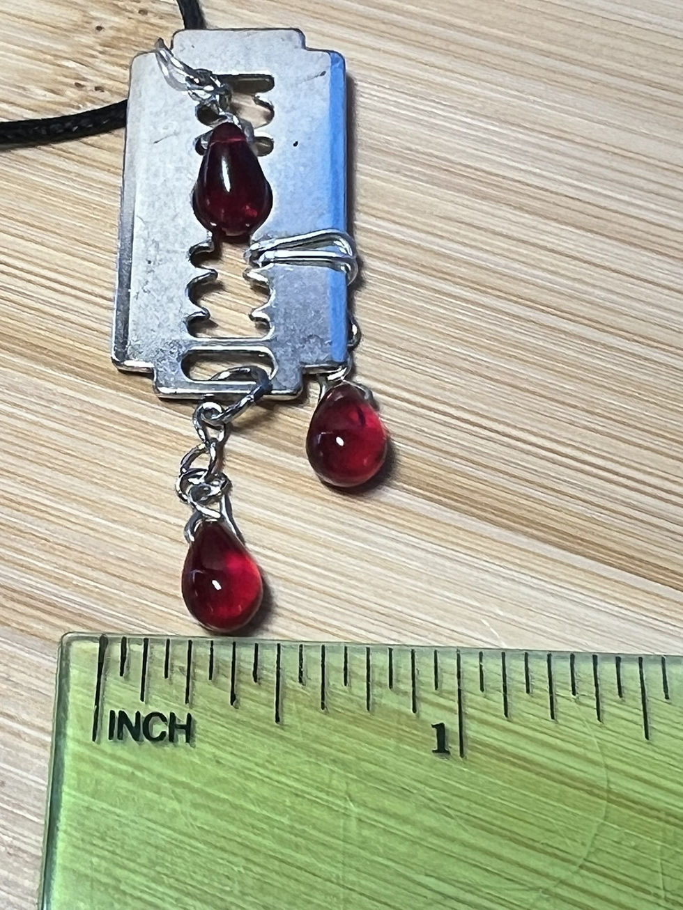 Thumbnail: Gothic razor blade necklace with three red teardrop bead dangles suspended from a waxed cord necklace width