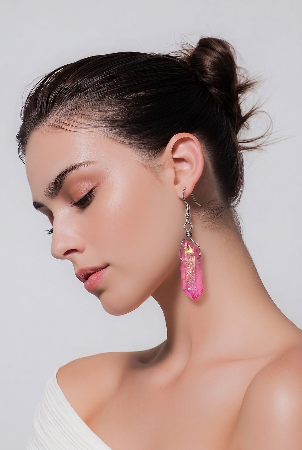 Thumbnail: Handmade fuchsia dyed quartz crystal earrings wrapped in silver wire with a bright bohemian style on model