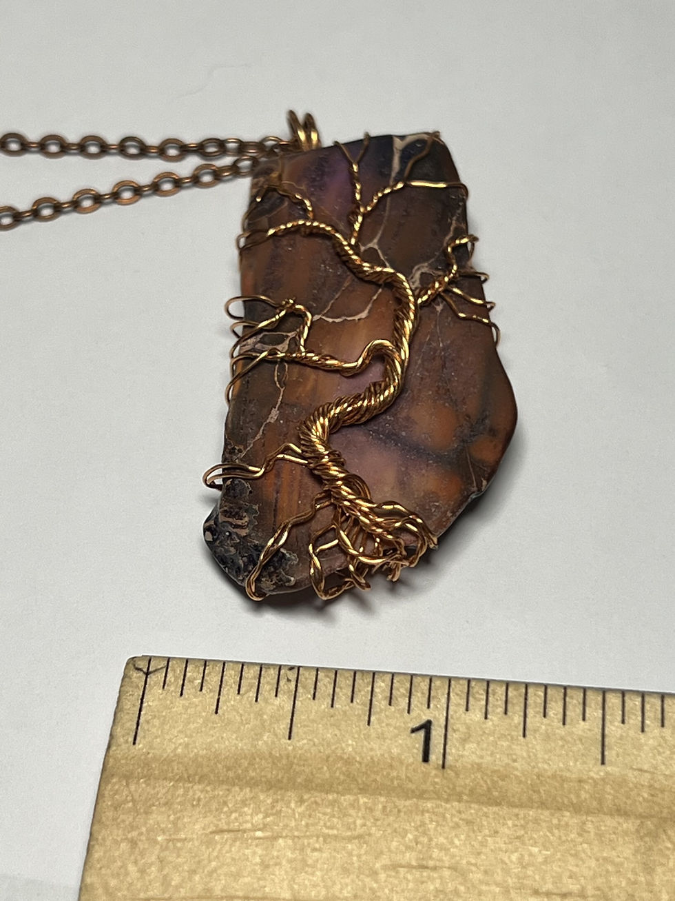 Thumbnail: Handmade purple jasper pendant featuring a copper wire Tree of Life design wrapped across a purple Jasper width