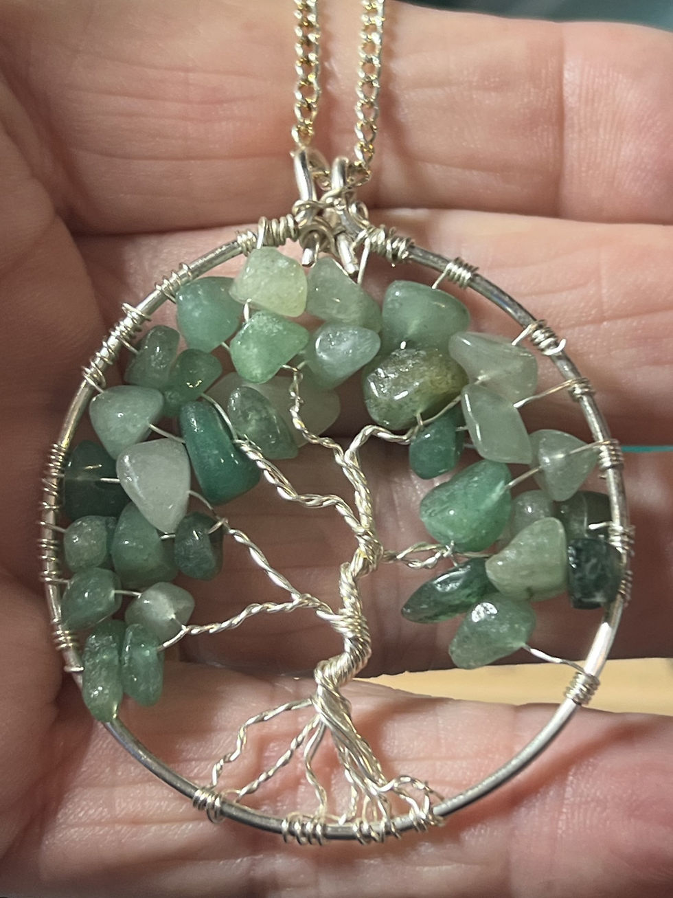 Thumbnail: One of a kind silver wire Tree of Life pendant with green aventurine gemstone chips in hand